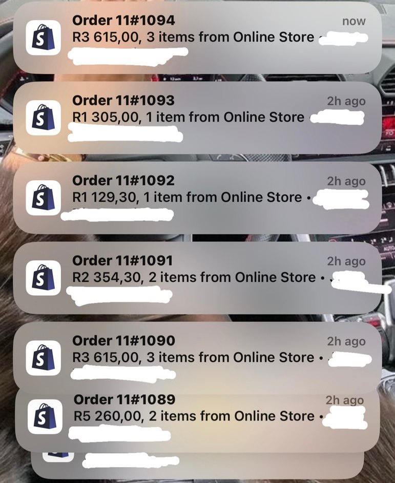 Shopify order notifications arriving on a phone